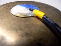 piezo disk covered with silicon, attached to a brass-bowl to detect acoustic vibration